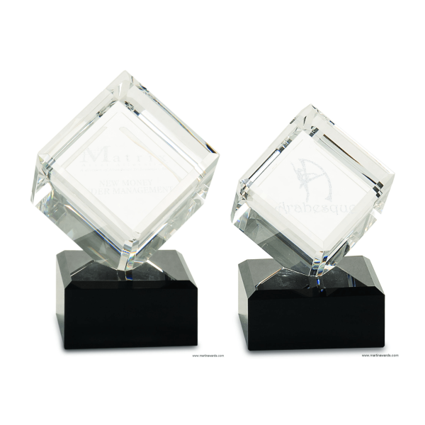 3-D cube on black base